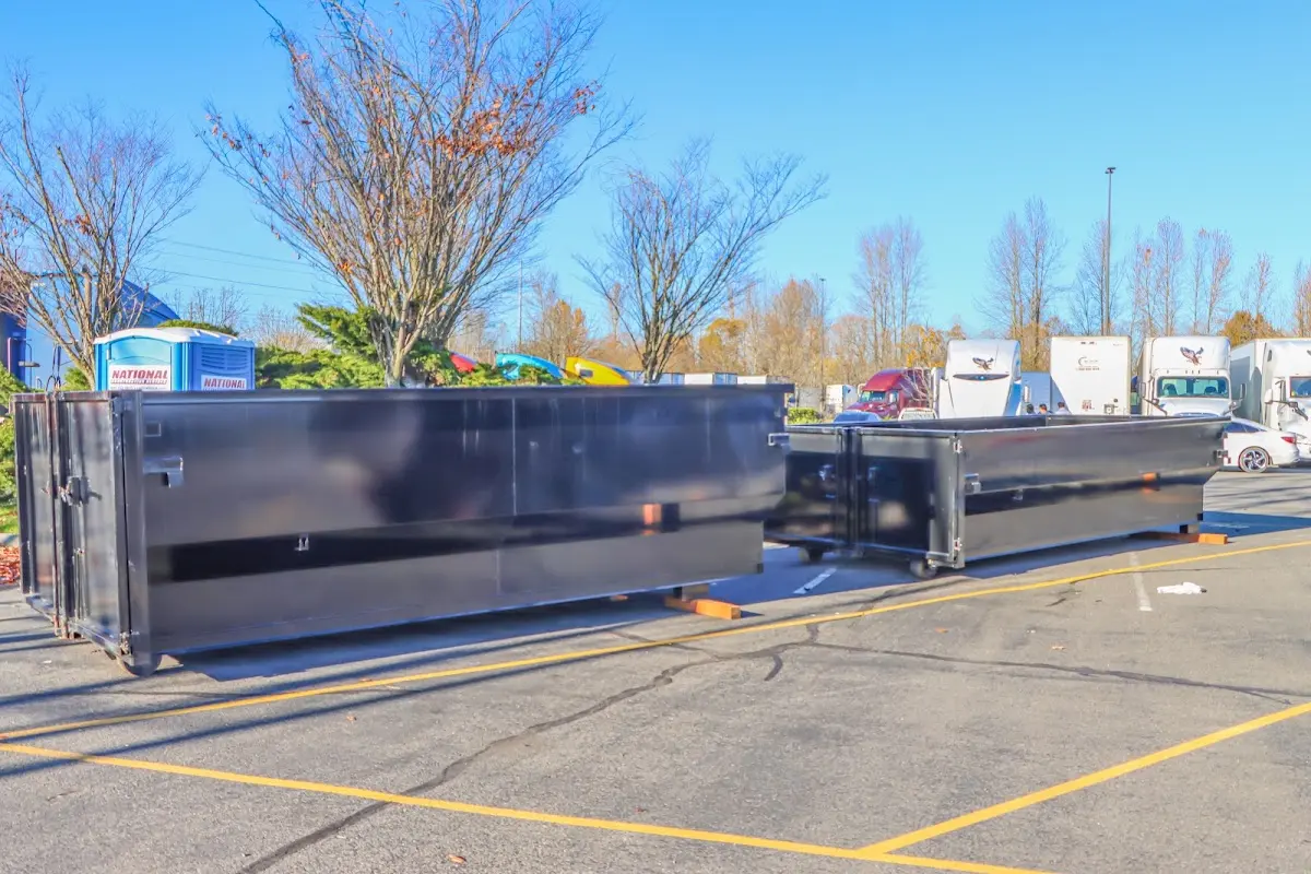 Professional dumpster rental service with roll-off container on residential driveway in Casa de Oro-Mount Helix